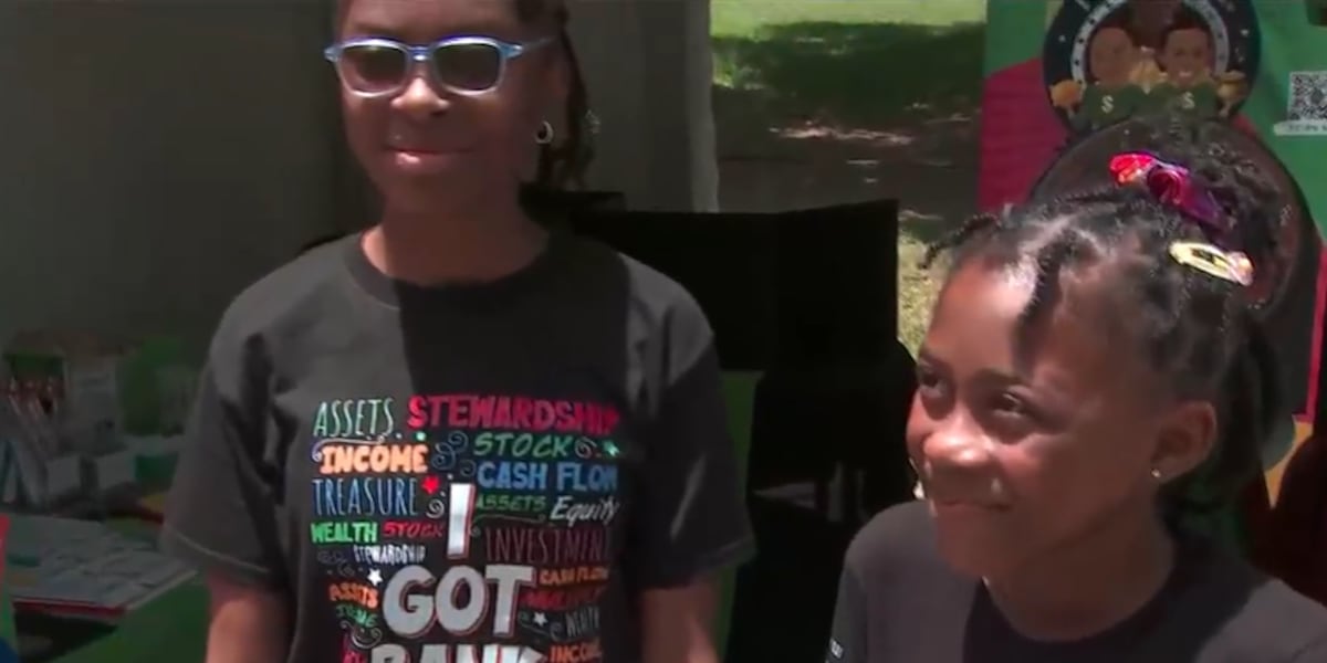 Two young entrepreneurs show off financial education business at Juneteenth parade [Video]