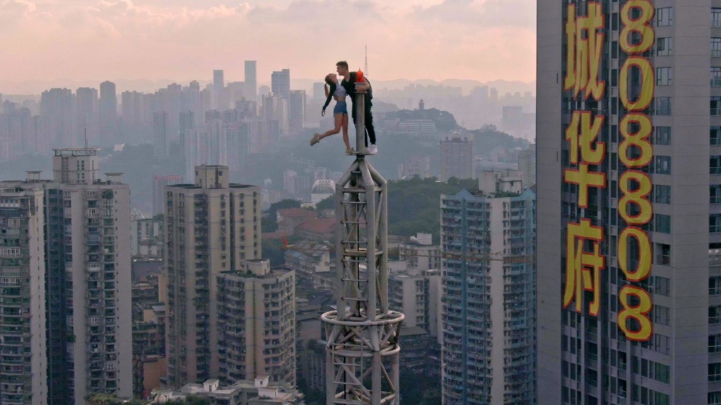 Couple illegally scale the world’s tallest buildings together [Video]