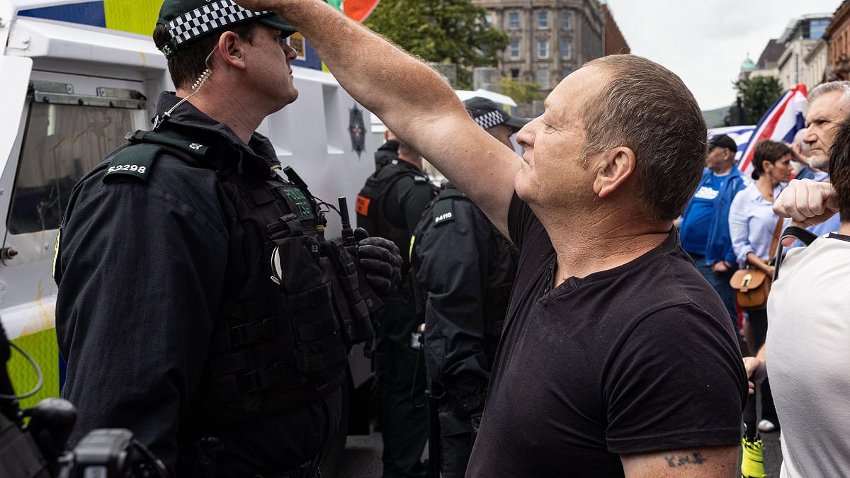 Britain’s disturbing underbelly hijacking the Southport tragedy: How far-right groups have organised violent riots on streets across the country – as footage emerges of one protester proudly showing off a Nazi tattoo [Video]